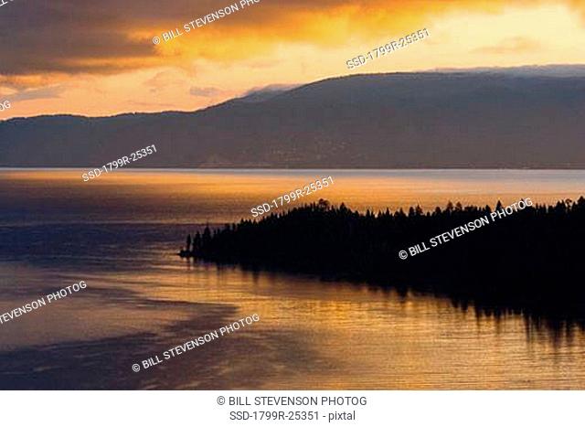 Clouds over a lake at sunrise, Lake Tahoe, California, USA