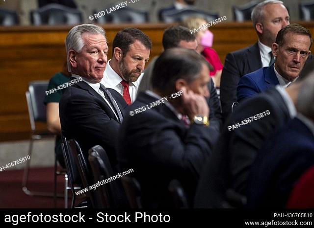 United States Senator Tommy Tuberville (Republican of Alabama), left, and United States Senator Markwayne Mullin (Republican of Oklahoma), second from left