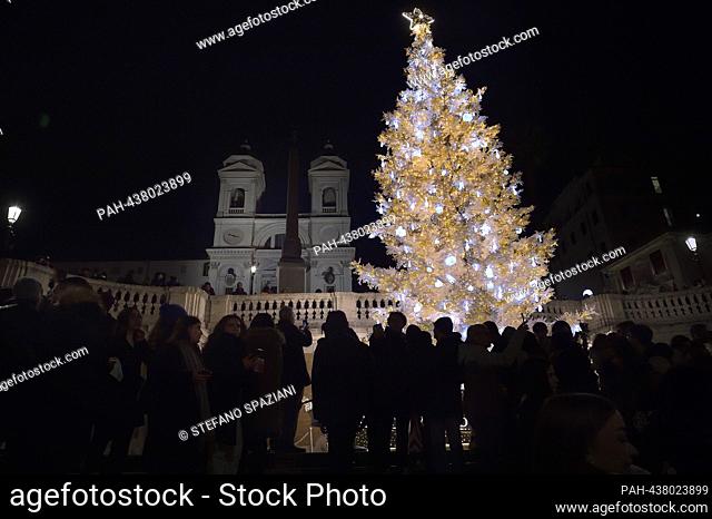 Dior lights up the Spain Square in Rome for Christmas. A large tree, over 15 meters high, decorated with the ""Christian Dior around the world"" ribbon and...
