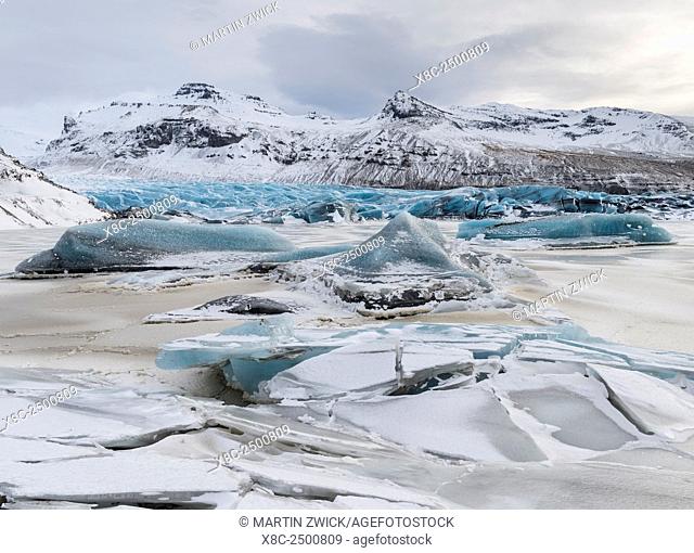 Glacier Svinafellsjoekul in the Vatnajoekull NP during winter. The glacier front and the frozen glacial lake. europe, northern europe, iceland, February