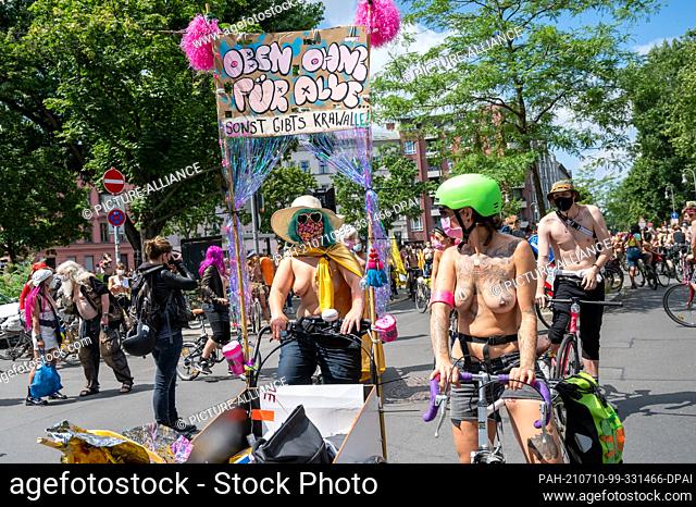 10 July 2021, Berlin: Participants of a bicycle demonstration ride through Berlin under the motto ""No Nipple is free until all Nipples are free! The...