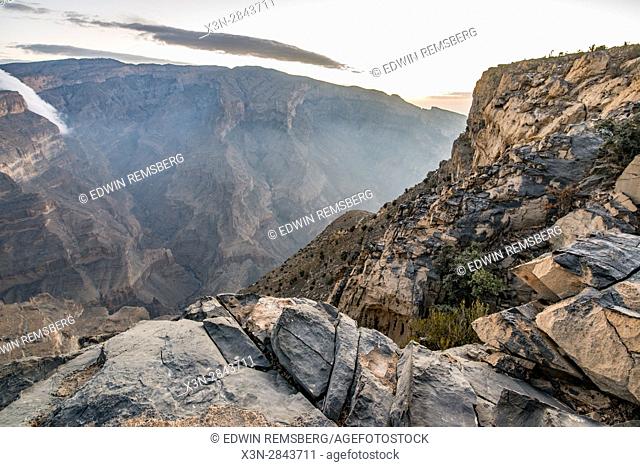 Jebel Shams; Sun shines over the summit and gorge at Oman's Grand Canyon