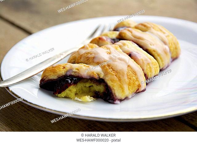 Homemade danish pastry filled with an elderberry jam and vanilla custard