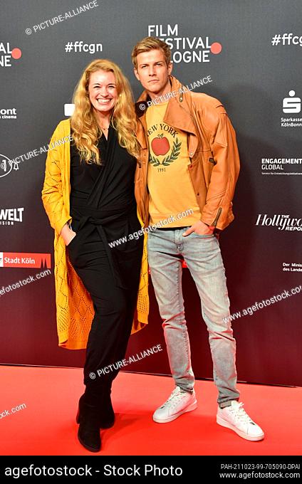 21 October 2021, North Rhine-Westphalia, Cologne: Actors Madeleine Krakor and Sebastian Kolb arrive at the opening of the Cologne 2021 Film Festival
