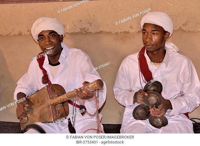 Gnaoua musicians, one playing a Sintir, the other one a Qarqaba, Merzouga, Meknès-Tafilalet region, Morocco