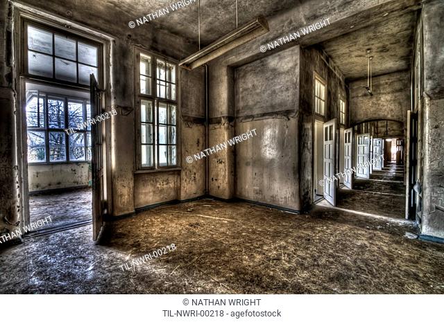 Abandoned lunatic asylum north of Berlin, Germany Empty room with corridor
