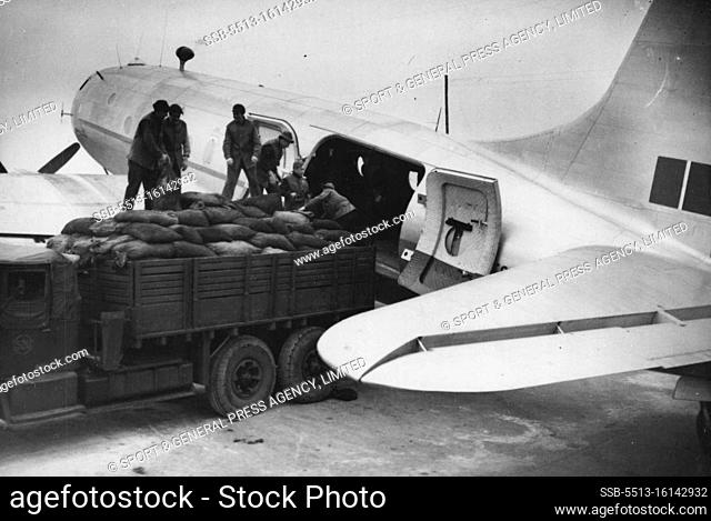 Britain's Latest Planes To Boost Berlin ""Air Lift"" -- German workmen loading coal into one of the new ""Hastings"" aircraft at the base near Kiel