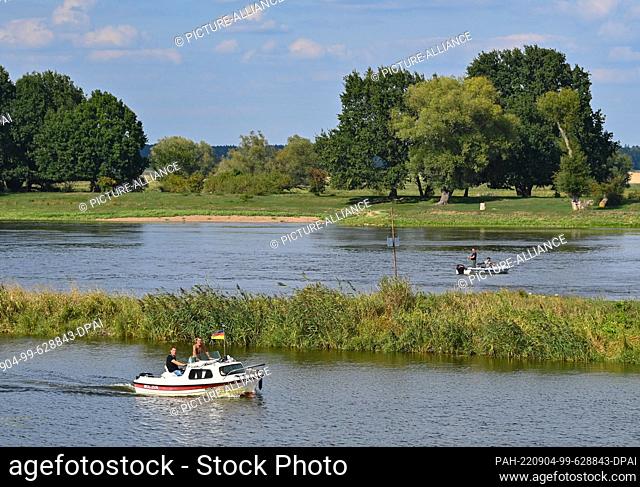 04 September 2022, Brandenburg, Kienitz: Boats sail on the German-Polish border river Oder. Local residents and nature conservationists made music along the...