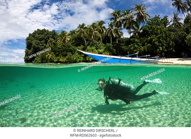 Scuba Diver in Lagoon of Ahe Island, Cenderawasih Bay, West Papua, Indonesia