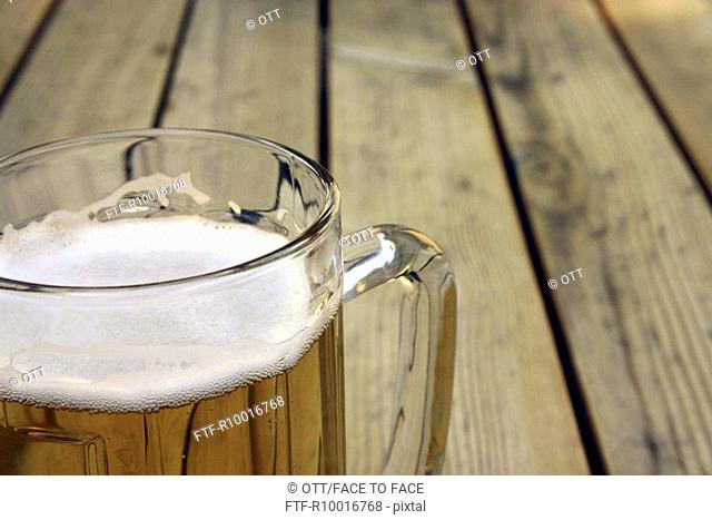 A section of a beer mug is seen at close up