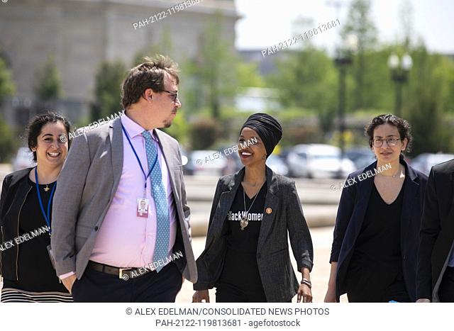 United States Representative Ilhan Omar, Democrat of Minnesota, walks with staff to a press event in front of the United States Capitol in Washington, D