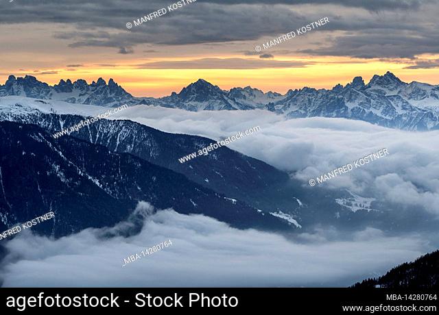 Sand in Taufers, Province of Bolzano, South Tyrol, Italy. Sunrise at the top of Sonnklar with view over the Pustertal valley to the Dolomites