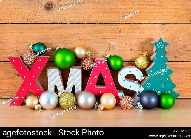 A wooden xmas text in a wooden box Christmas symbols decoration