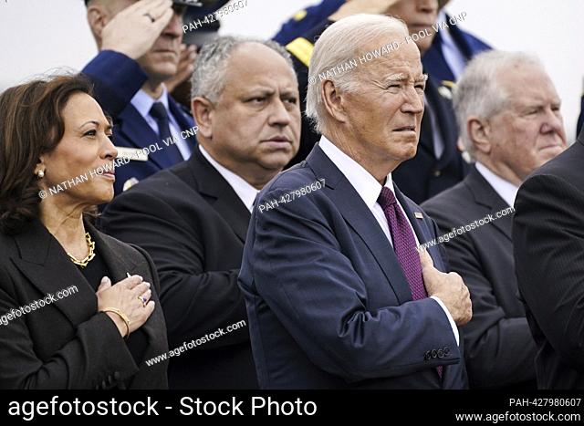 United States Vice President Kamala Harris and US President Joe Biden listen during a ceremony at the Armed Forces Farewell Tribute in honor of General Mark A