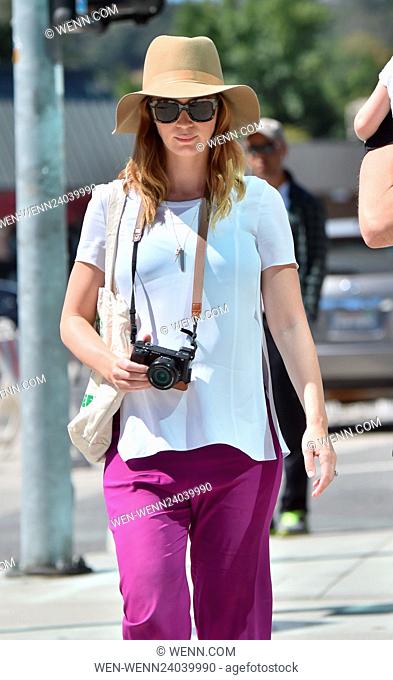 Pregnant Emily Blunt and her husband John Krasinsky take their daughter to a farmer's market. Emily snapped away on her camera while John carried their little...