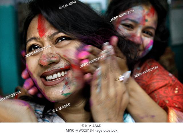 Smiling women celebrating the colourful Holi festival which usually takes place in late February or early March The festival has an ancient origin and...