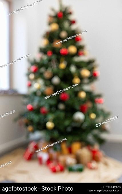 blurred decorated christmas tree at home