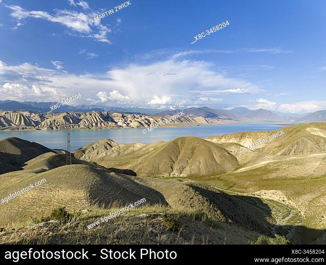 Landscape at Toktogul Reservoir and river Naryn in the Tien Shan or heavenly mountains. Energy is one of the most important export commodities