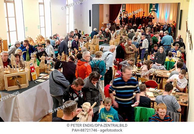 Visitors in Anneberg-Buchholz, Germany, 04 March 2017. The town is hosting the 25th wood carving festival. Over 200 wood carvers will make their to the town to...