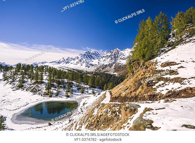 Reflection into Lago del Sangiatto in Alpe Devero, province of Verbano Cusio - Ossola, Piedmont, Italy