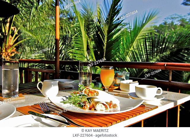 A table is laid out for breakfast at Hotel Four Seasons, Sayan, Ubud, Central Bali, Indonesia, Asia