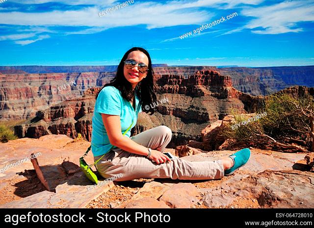 Photo of a lady at the famous Grand Canyon in Arizona, USA