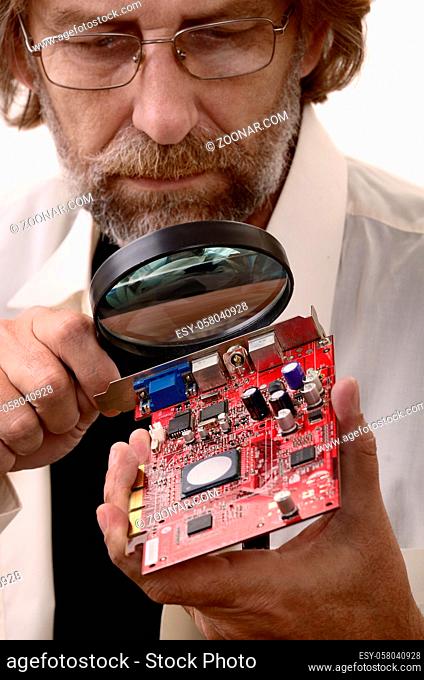 elderly man reconditioning computer on a white background