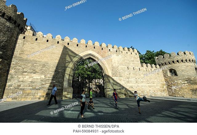 Children are playing soccer in front of the historic city wall prior to the 2015 European Games in Baku, Azerbaijan, 10 June 2015