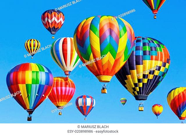 Colorful hot air balloons over blue sky