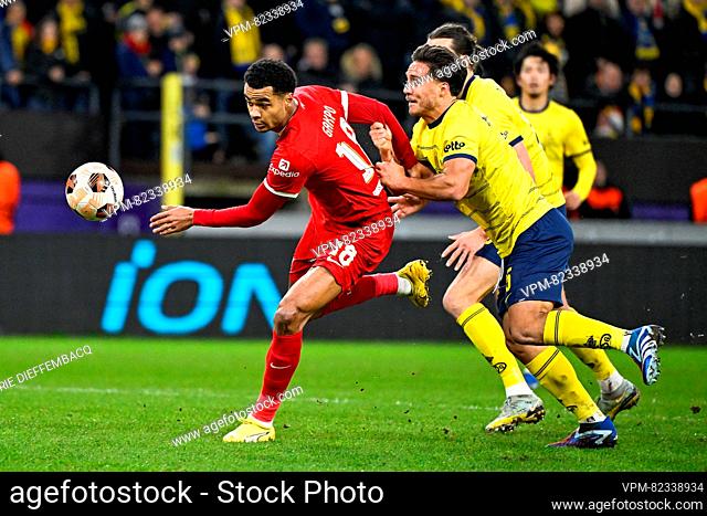 Liverpool's Cody Gakpo and Union's Kevin Mac Allister fight for the ball during a game between Belgian soccer team Royale Union Saint Gilloise and English club...