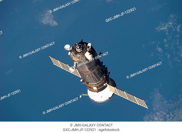 An unpiloted ISS Progress resupply vehicle approaches the International Space Station, bringing 2.6 tons of food, fuel, oxygen