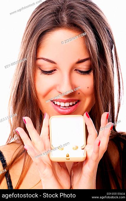 Happy woman with jewels in box over white background
