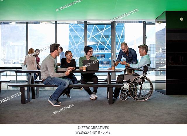 Group of people having a meeting in modern office