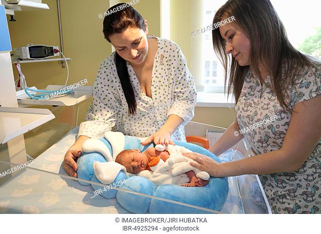 Mother with nurse takes care of newborn in intensive care unit, Karlovy Vary, Czech Republic, Europe