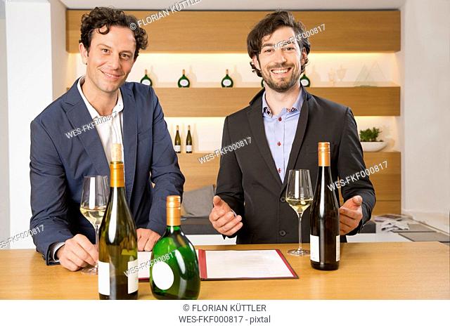 Two salesmen in a wine shop