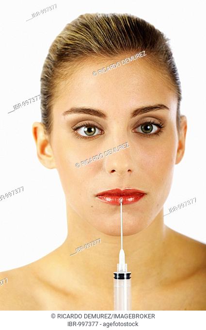 Young woman getting an injection for fuller lips