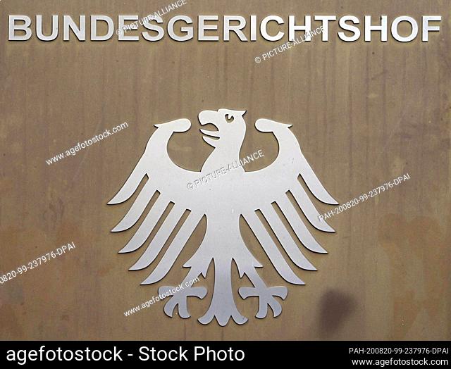 20 August 2020, Baden-Wuerttemberg, Karlsruhe: A signpost with federal eagle and lettering Bundesgerichtshof (Federal Court of Justice)