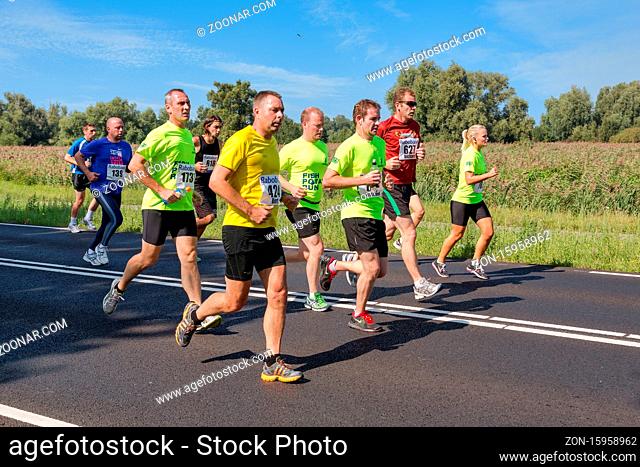 Urk, The Netherlands- September 08, 2012: Runners of foot race 'Fish Potato Run' between Urk and Emmeloord, The Netherlands