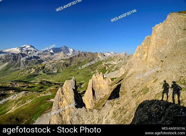 Shadow of tourists on cliff at vacation, Vanoise National Park, France