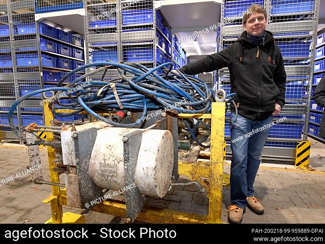 18 February 2020, Schleswig-Holstein, Kiel: Martin Steen from Geomar's Technology and Logistics Centre stands next to the recovered part of a mysteriously...