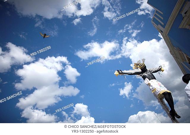 A pigeon flies near the black Christ of Saint Roman during a procession in Campeche state, Mexico, June 20, 2009