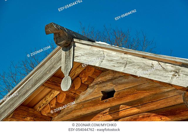 Russian Traditional wooden architecture - Chudsky konek , Top log on the roof of the houseMalye Karely village, Arkhangelsk region, Russia