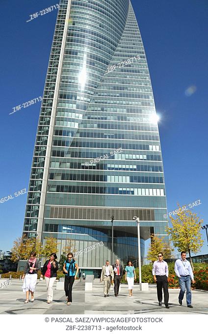 Office workers walk along the skyscrapers of the CTBA (Cuatro Torres Business Area) in Madrid's finance and business district