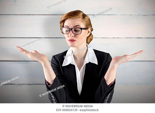 Composite image of businesswoman holding hand out in presentation