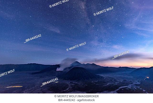 Night sky with stars, smoking volcano Mount Gunung Bromo, Mount Batok in front, Mount Kursi at back, Mount Gunung Semeru, Bromo Tengger Semeru National Park