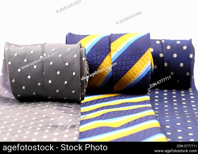 Three rolled up necktie isolated on white background