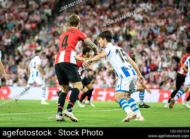 BILBAO, SPAIN - OCTOBER 05, 2018: Iñigo Martinez (L) and Aritz Elustondo (R) dispute the ball during a Spanish League match between Athletic Club Bilbao and...