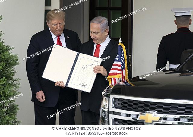 United States President Donald J. Trump and the Prime Minister of Israel, Benjamin Netanyahu display a proclamation signed by Trump recognizing the Golan...