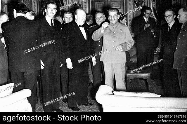 Mr, Churchil's 69th Birthday in Teheran -- Marshal Stalin toasts the allied nations at Mr. Churchill's birthday party. Mr