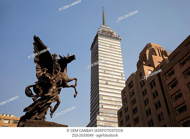 View to the Torre Latinoamericana, 44 stories tall skyscraper with a statue in the foreground, Mexico City, Mexico, Central America